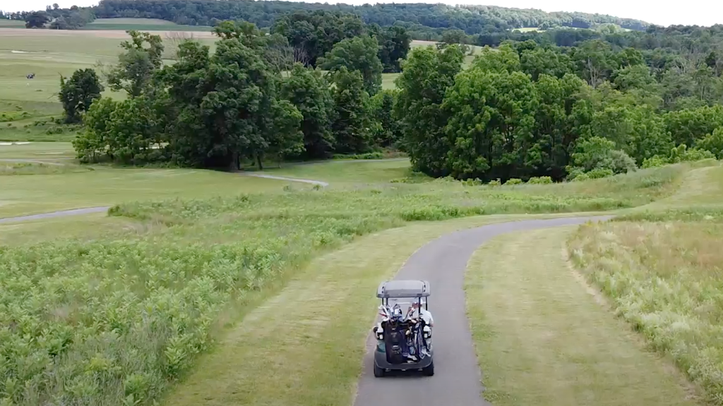 Panoramic view of a lush green golf course at Olde Homestead Golf Club. Smooth