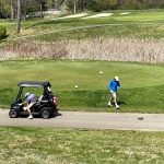 green grass with the flag in the hole.