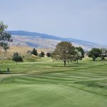 Panoramic view of a lush green golf course at Olive Glenn Golf Club. Smooth