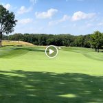 green grass with the flag in the hole.