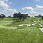 Panoramic view of a lush green golf course at Omaha Country Club. Smooth