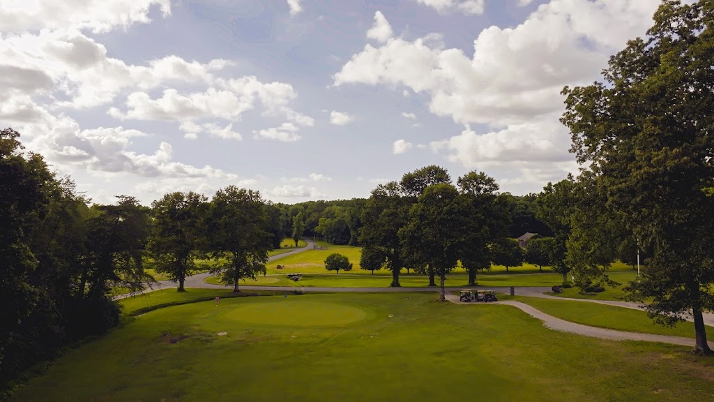 Panoramic view of a lush green golf course at Oneida Municipal Golf Course. Smooth