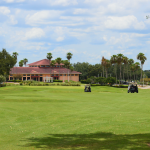 Panoramic view of a lush green golf course at Orange County National Golf Center and Lodge. Smooth