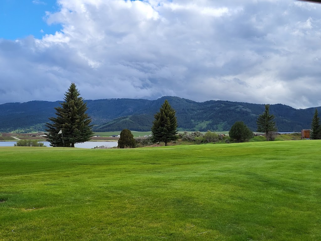 Panoramic view of a lush green golf course at Oregon Trail Country Club. Smooth