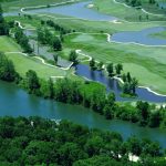 Panoramic view of a lush green golf course at Osage National Golf Course. Smooth