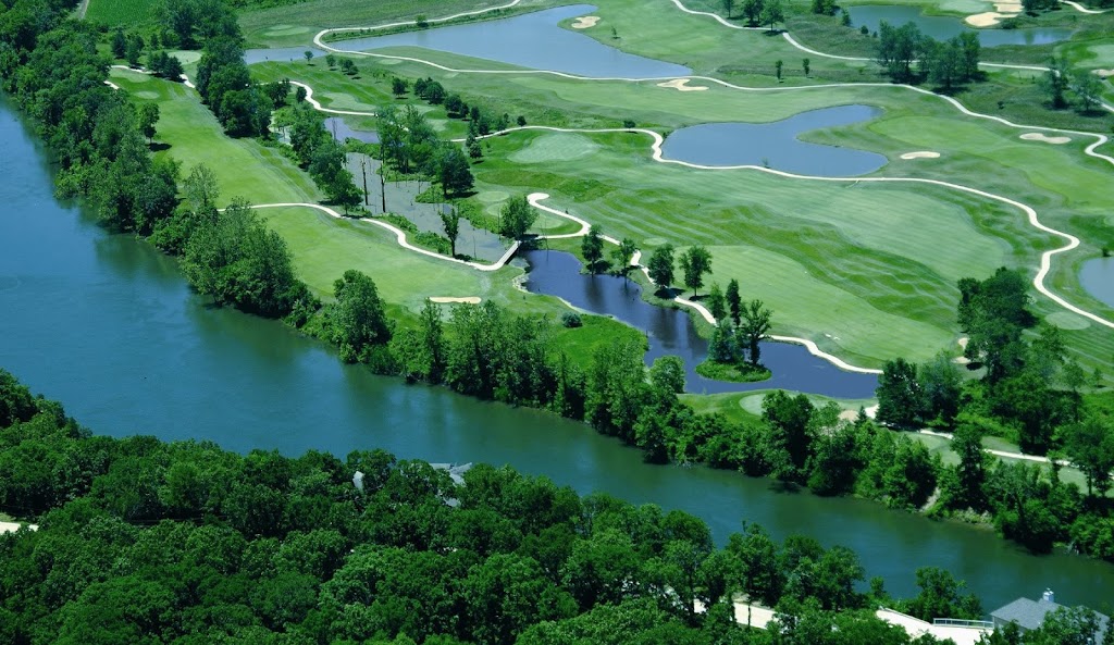 Panoramic view of a lush green golf course at Osage National Golf Course. Smooth
