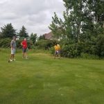 green grass with the flag in the hole.