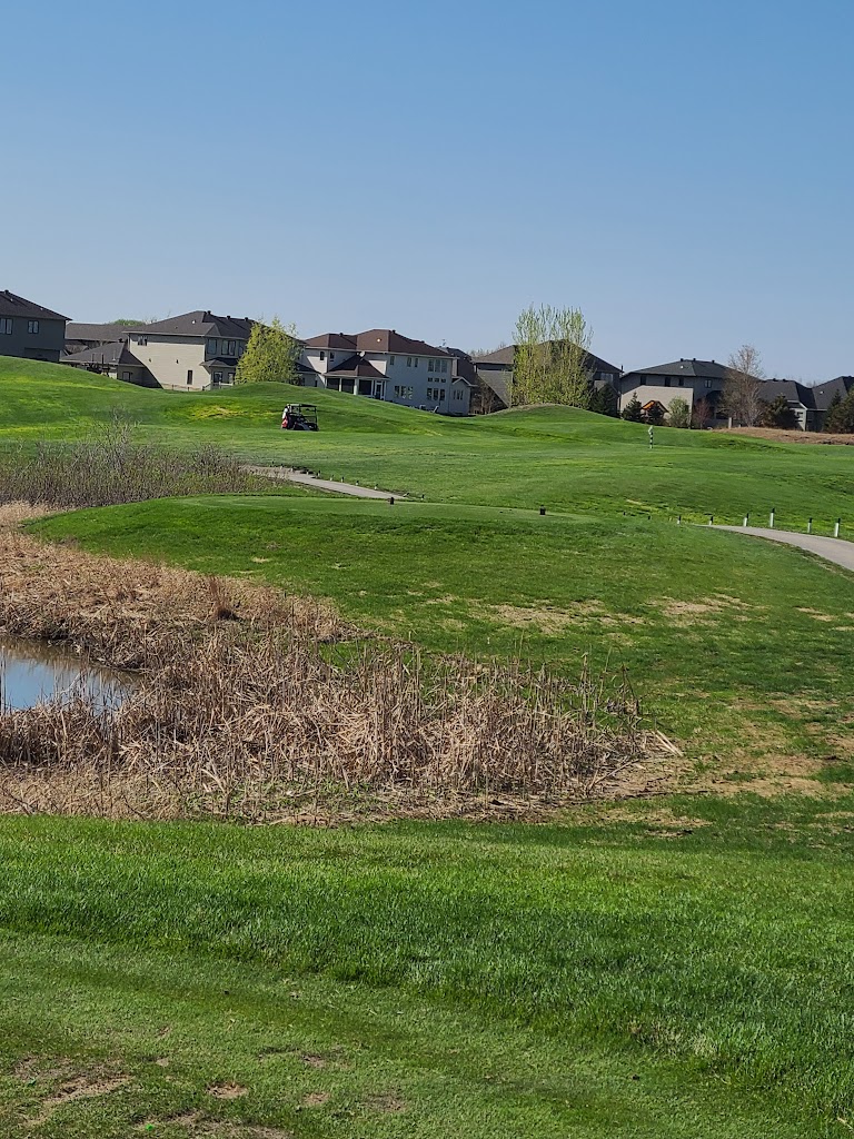 Panoramic view of a lush green golf course at Osgood Golf Course. Smooth