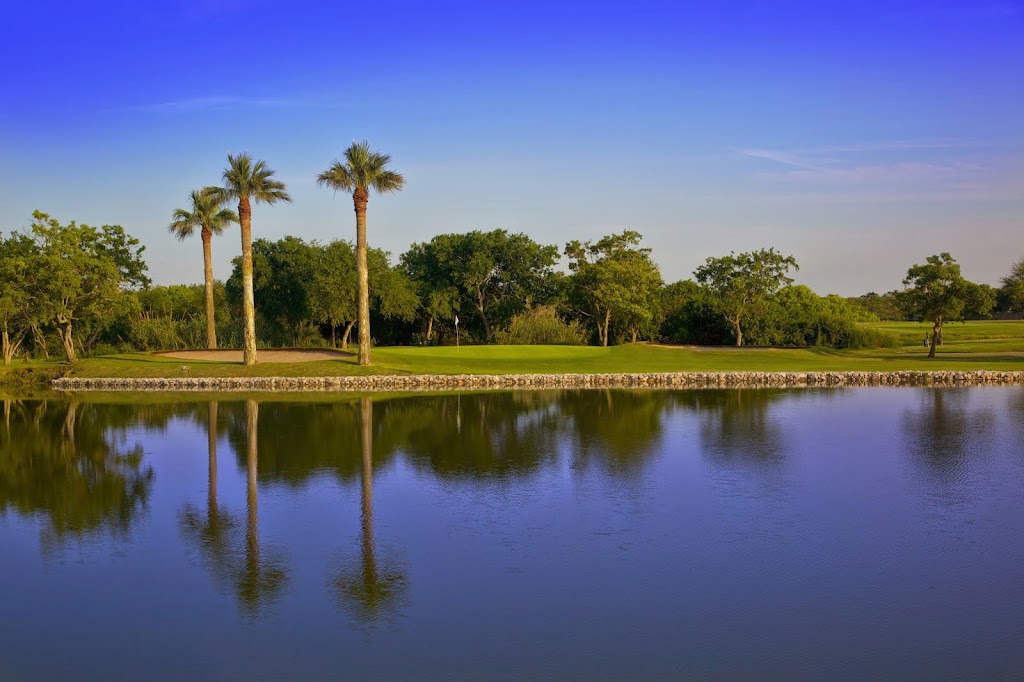 Panoramic view of a lush green golf course at Oso Beach Municipal Golf Course. Smooth