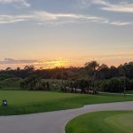 Panoramic view of a lush green golf course at Osprey Point Golf Course. Smooth