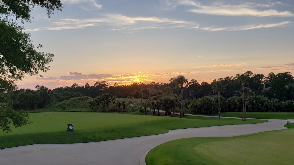 Panoramic view of a lush green golf course at Osprey Point Golf Course. Smooth