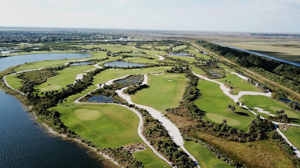 Panoramic view of a lush green golf course at Osprey Point Golf Course. Smooth