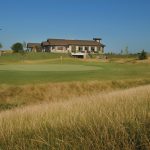 green grass with the flag in the hole.