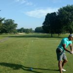 green grass with the flag in the hole.