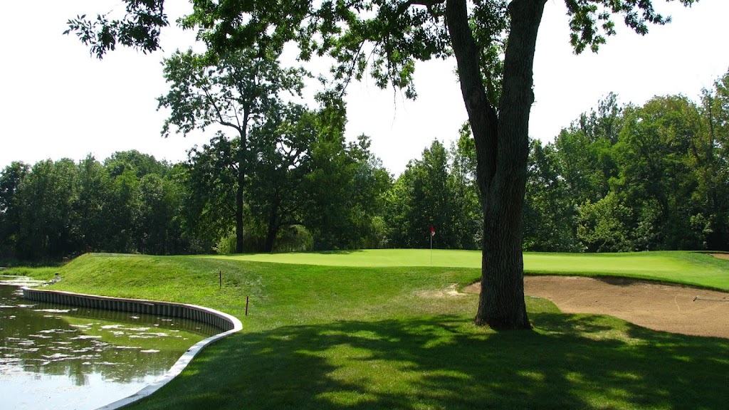 Panoramic view of a lush green golf course at Otter Creek Golf Course. Smooth