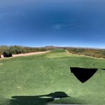 Panoramic view of a lush green golf course at Outlaw golf course. Smooth