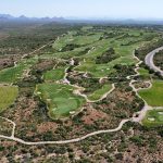Panoramic view of a lush green golf course at Outlaw golf course. Smooth