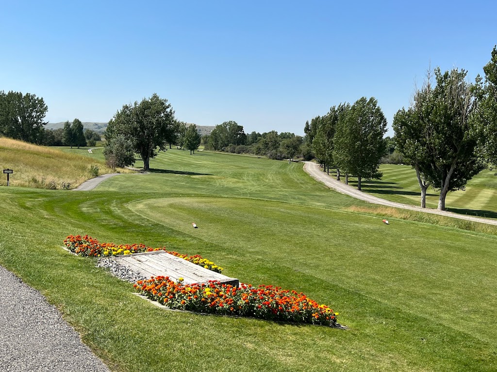 Panoramic view of a lush green golf course at Overland Golf Course. Smooth