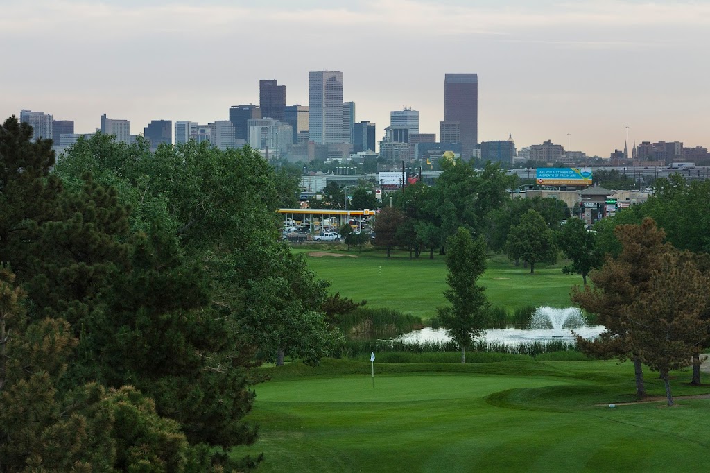 Panoramic view of a lush green golf course at Overland Golf Course. Smooth