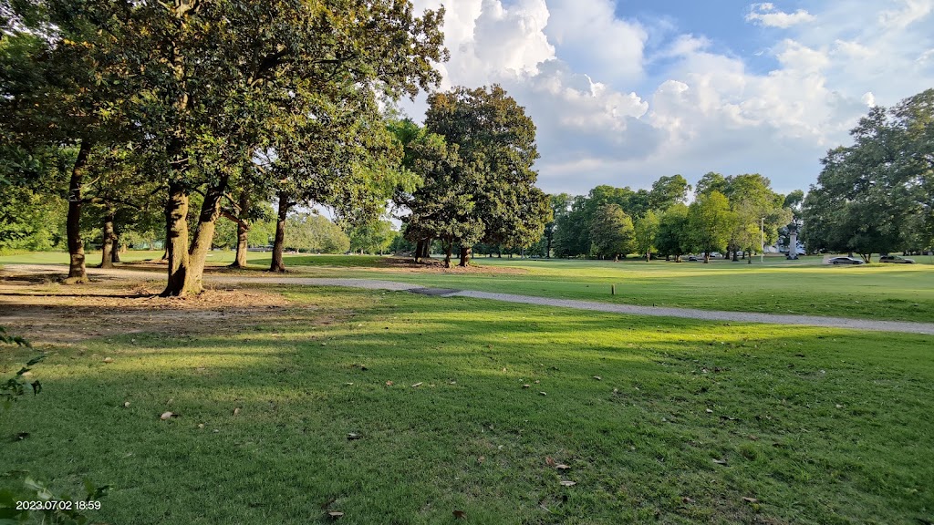 Panoramic view of a lush green golf course at Overton Park 9. Smooth