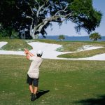 green grass with the flag in the hole.