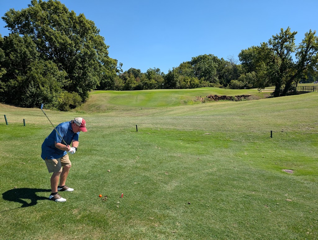Panoramic view of a lush green golf course at Page Belcher Golf Course. Smooth