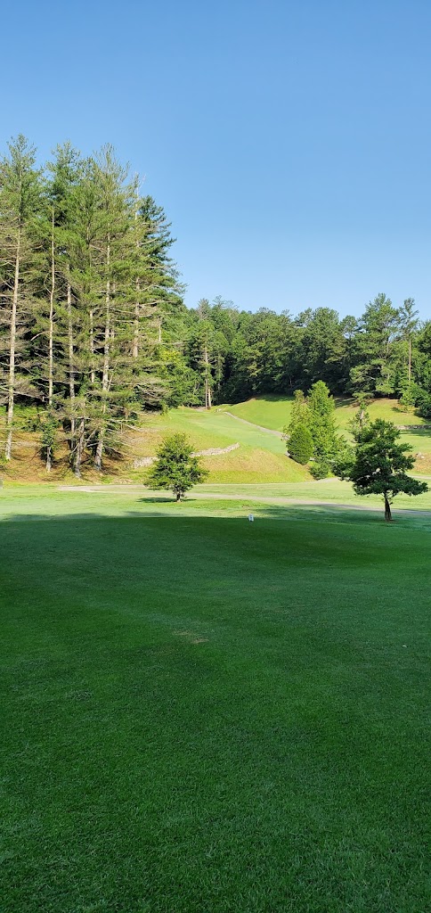 Panoramic view of a lush green golf course at Paintsville Golf Course. Smooth