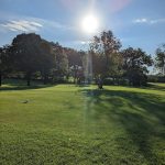 Panoramic view of a lush green golf course at Palatine Hills Golf Course & Clubhouse. Smooth