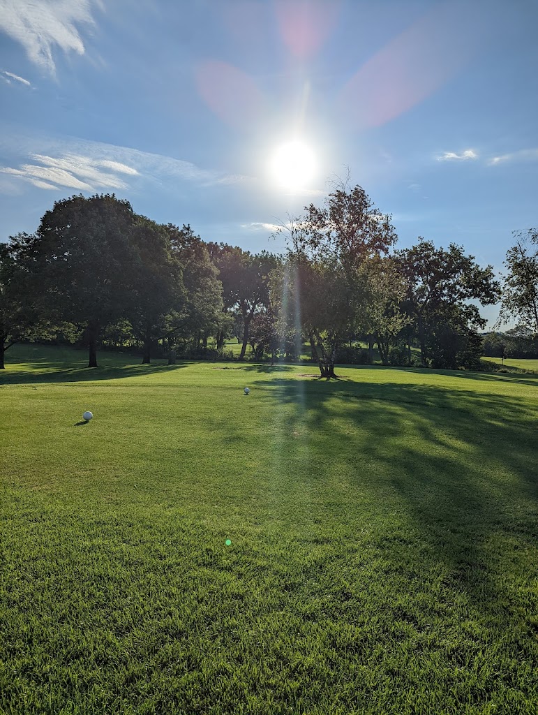 Panoramic view of a lush green golf course at Palatine Hills Golf Course & Clubhouse. Smooth