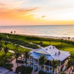 Panoramic view of a lush green golf course at Palm Beach Par-3 Golf Course. Smooth