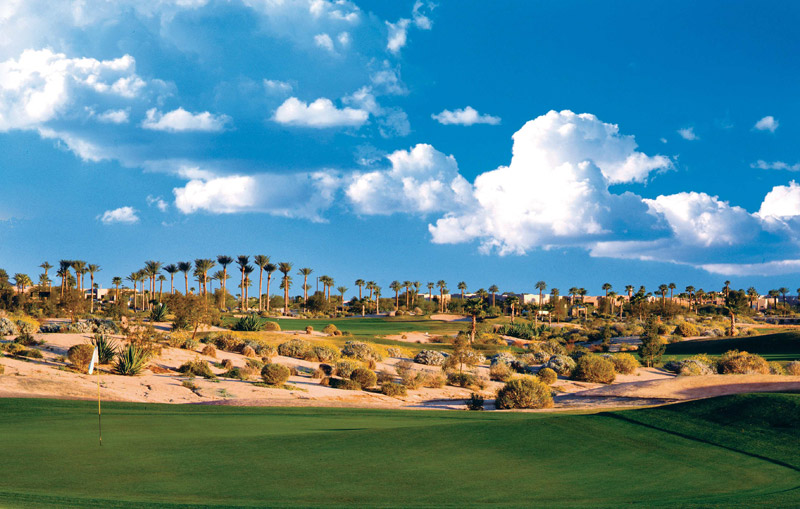 Panoramic view of a lush green golf course at Palm Valley Golf Club. Smooth