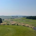 Panoramic view of a lush green golf course at Palouse Ridge Golf Club. Smooth