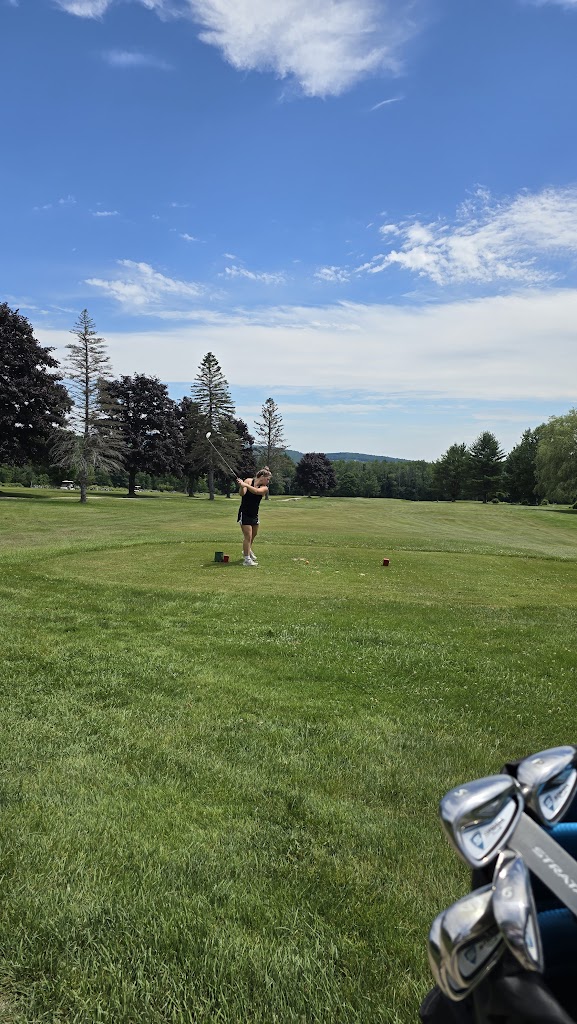 Panoramic view of a lush green golf course at Paris Hill Country Club. Smooth