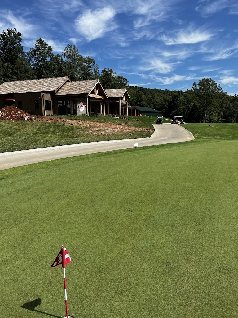 Panoramic view of a lush green golf course at Park Mammoth Golf Club. Smooth