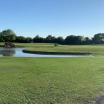 Panoramic view of a lush green golf course at Pasadena Municipal Golf Course. Smooth