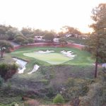 Panoramic view of a lush green golf course at Pasatiempo Golf Course. Smooth
