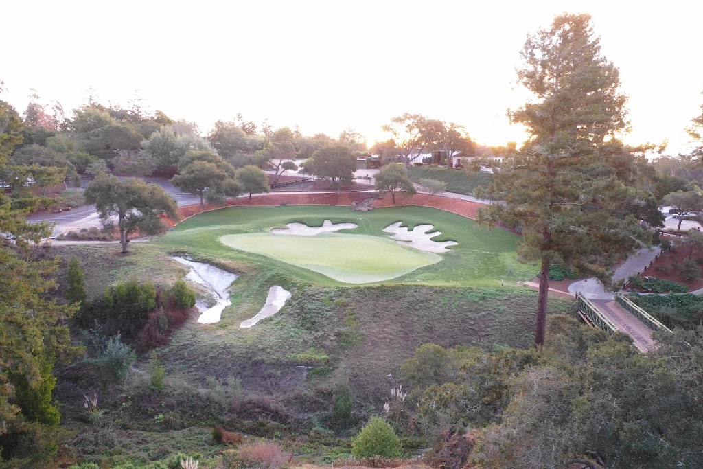 Panoramic view of a lush green golf course at Pasatiempo Golf Course. Smooth