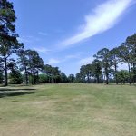 Panoramic view of a lush green golf course at Pascagoula Country Club. Smooth
