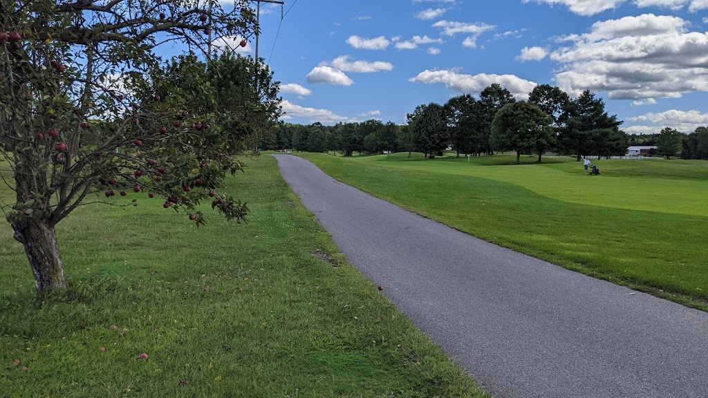 Panoramic view of a lush green golf course at Passaconaway Country Club. Smooth