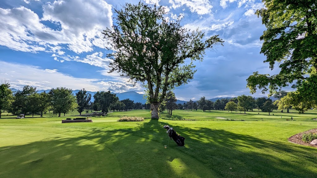 Panoramic view of a lush green golf course at Patty Jewett Golf Course. Smooth