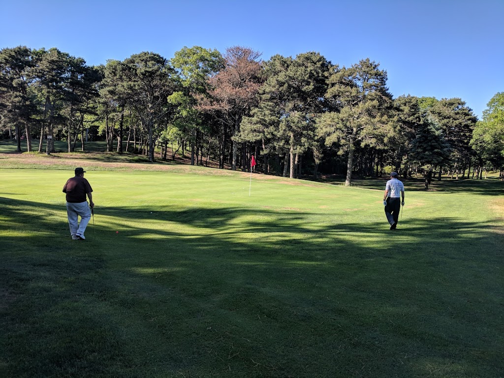 Panoramic view of a lush green golf course at Paul Harney Golf Club. Smooth