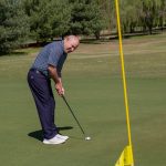 green grass with the flag in the hole.
