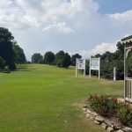 Panoramic view of a lush green golf course at Paxton Park Golf Course. Smooth