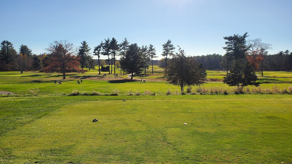 Panoramic view of a lush green golf course at Pease Golf Course. Smooth
