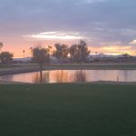 green grass with the flag in the hole.