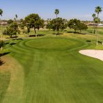 Panoramic view of a lush green golf course at Pebblebrook Golf Course. Smooth