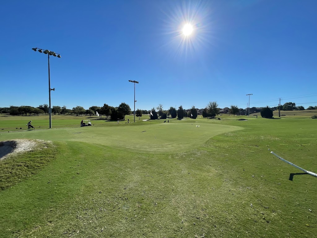 Panoramic view of a lush green golf course at Pecan Hollow Golf Course. Smooth