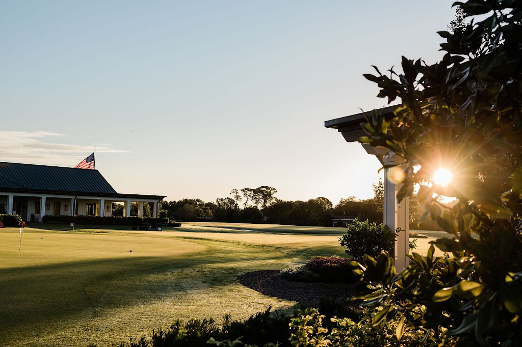 Panoramic view of a lush green golf course at Pelican Golf Club. Smooth