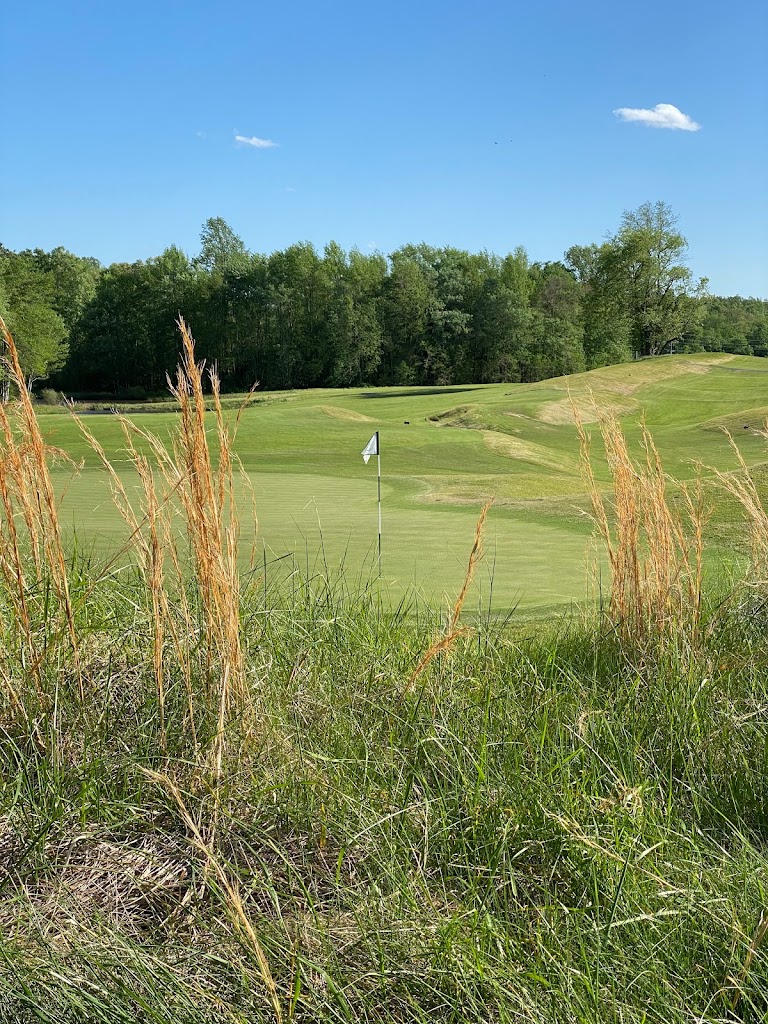 Panoramic view of a lush green golf course at Pendleton Golf Club. Smooth