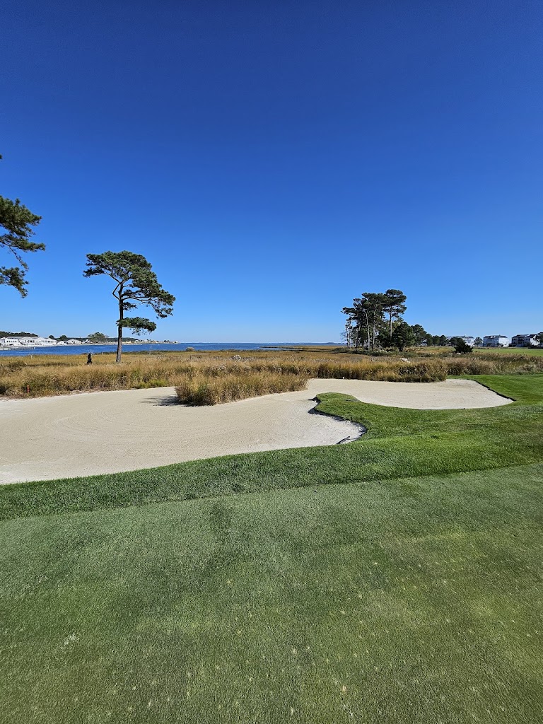 Panoramic view of a lush green golf course at Peninsula Golf & Country Club. Smooth